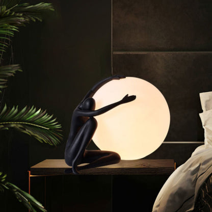 Humanoid Ball Holding Table Lamp Table lamp