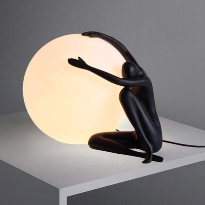 Humanoid Ball Holding Table Lamp Table lamp