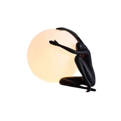 Humanoid Ball Holding Table Lamp Table lamp